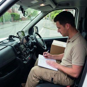 writing notes in truck cab